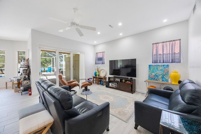 4815 Queen Palm Ter NE, Saint Petersburg, FL 33703 - living room with a ceiling fan, recessed lighting, and light wood-style flooring