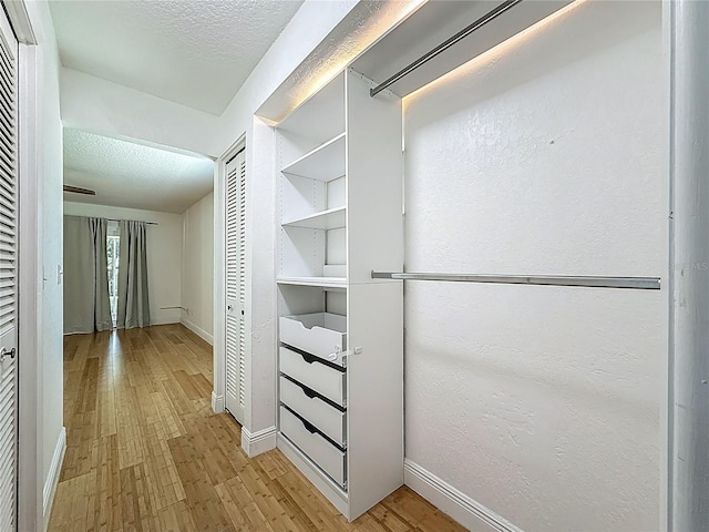 13891 Feather Sound Dr, Clearwater, FL 33762 - spacious closet featuring light wood-style floors