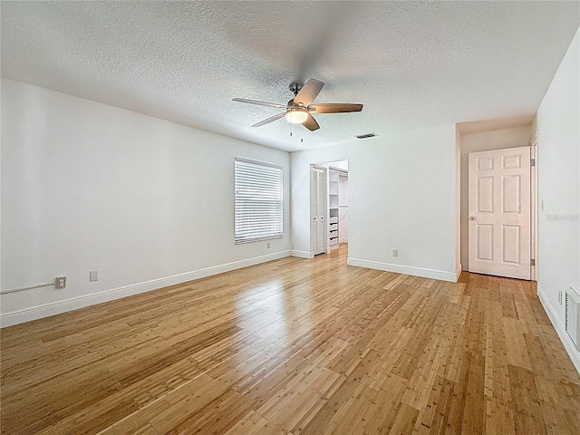 13891 Feather Sound Dr, Clearwater, FL 33762 - spare room with ceiling fan, light wood-type flooring, and a textured ceiling