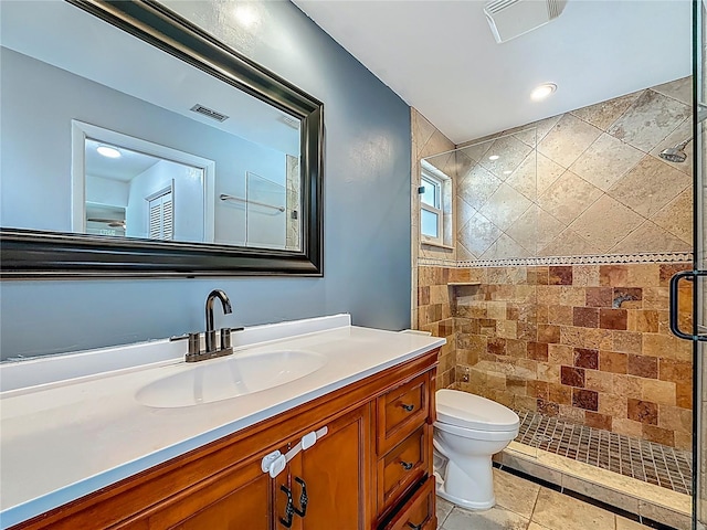 13891 Feather Sound Dr, Clearwater, FL 33762 - bathroom featuring a shower stall, vanity, and tile patterned floors