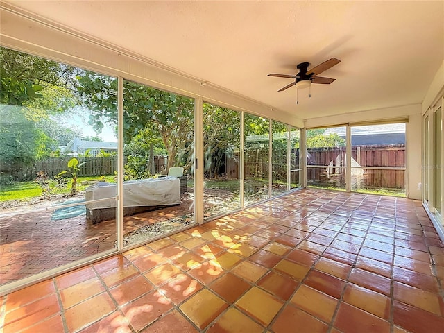 13891 Feather Sound Dr, Clearwater, FL 33762 - unfurnished sunroom featuring ceiling fan