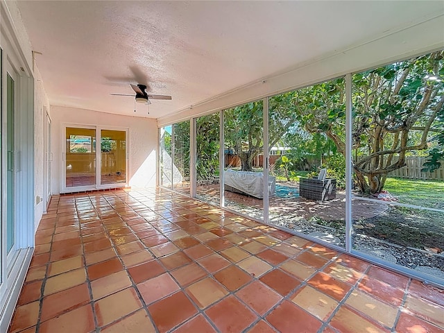 13891 Feather Sound Dr, Clearwater, FL 33762 - unfurnished sunroom featuring a ceiling fan