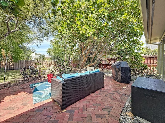 13891 Feather Sound Dr, Clearwater, FL 33762 - fenced backyard with outdoor lounge area, a patio area, and a grill