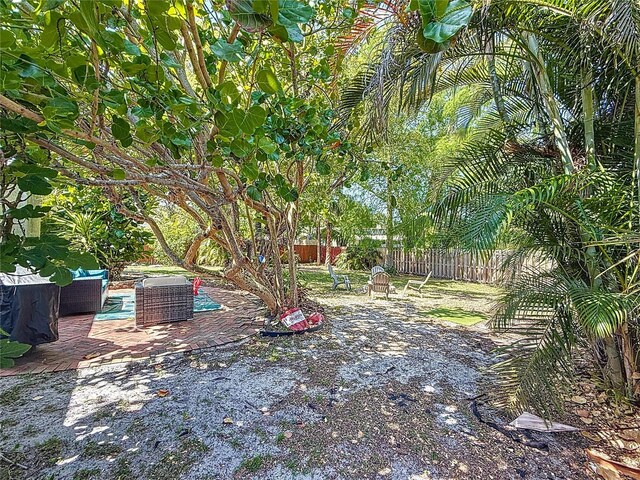 13891 Feather Sound Dr, Clearwater, FL 33762 - view of yard with an outdoor living space and a patio