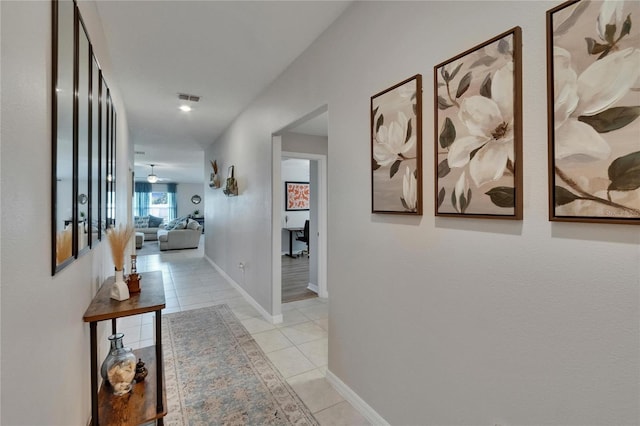 13506 Wild Ginger St, Riverview, FL 33579 - hallway with light tile patterned flooring and baseboards