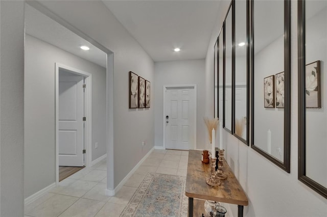 13506 Wild Ginger St, Riverview, FL 33579 - hallway with light tile patterned floors and recessed lighting