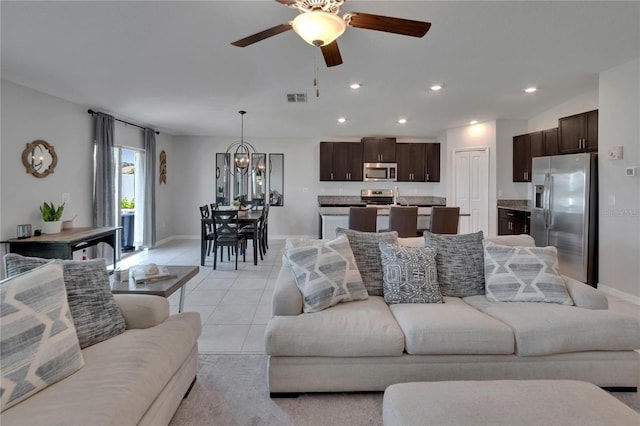 13506 Wild Ginger St, Riverview, FL 33579 - living area with a ceiling fan, light tile patterned floors, recessed lighting, and a chandelier