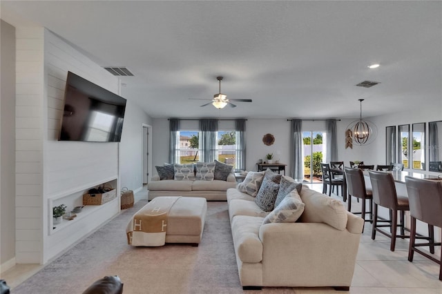 13506 Wild Ginger St, Riverview, FL 33579 - living room featuring a chandelier and a ceiling fan