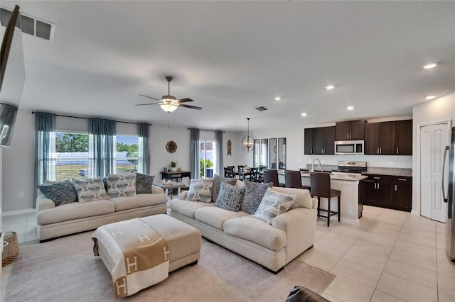 13506 Wild Ginger St, Riverview, FL 33579 - living area with ceiling fan, recessed lighting, and light tile patterned floors
