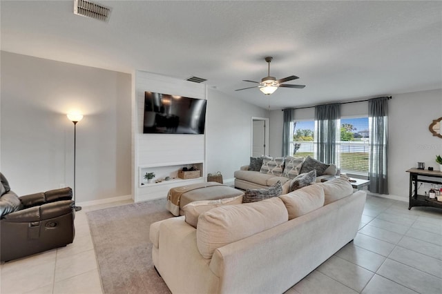 13506 Wild Ginger St, Riverview, FL 33579 - living room with ceiling fan and light tile patterned floors