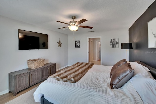 13506 Wild Ginger St, Riverview, FL 33579 - bedroom featuring a ceiling fan and light wood-style floors