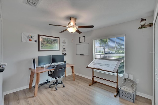13506 Wild Ginger St, Riverview, FL 33579 - office area featuring a ceiling fan and light wood finished floors