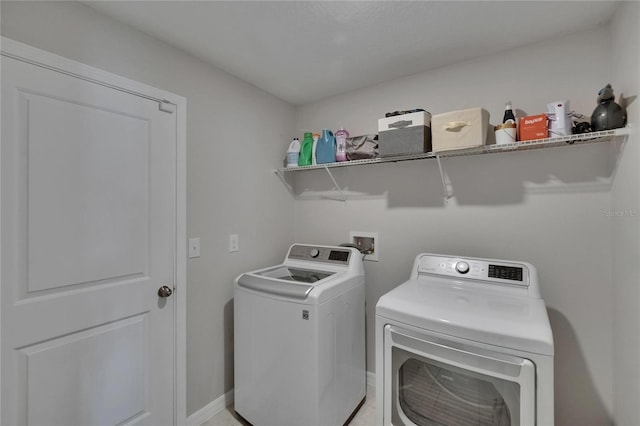 13506 Wild Ginger St, Riverview, FL 33579 - washroom featuring washing machine and clothes dryer and baseboards