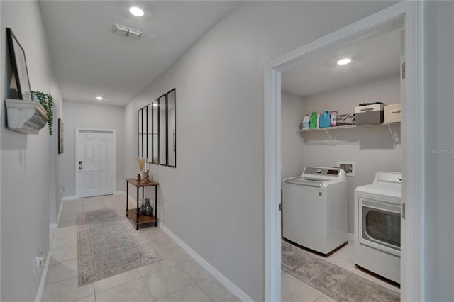 13506 Wild Ginger St, Riverview, FL 33579 - laundry area with washer and dryer, light tile patterned flooring, and recessed lighting