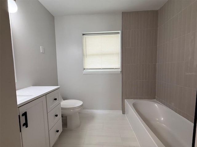 1505 Piedmont Dr, Deltona, FL 32725 - full bathroom featuring vanity, toilet, baseboards, and tile patterned flooring