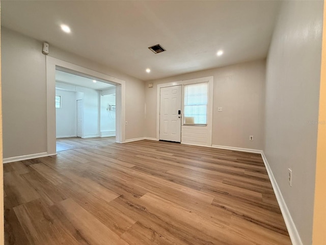 1505 Piedmont Dr, Deltona, FL 32725 - entrance foyer with wood finished floors, recessed lighting, and baseboards