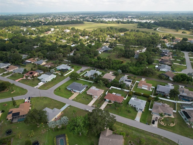 birds eye view of property with a residential view