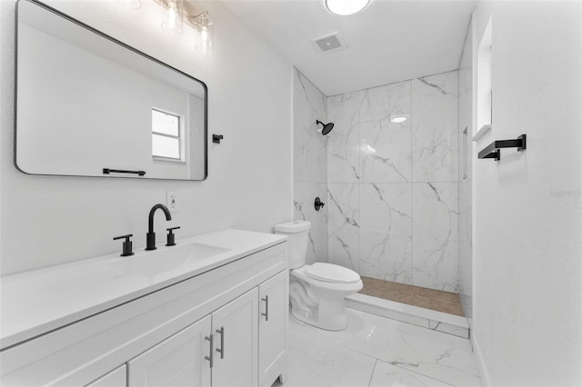 full bath featuring toilet, marble finish floor, visible vents, vanity, and a marble finish shower