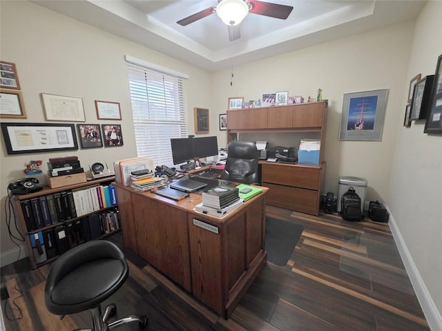 13525 Gorgona Isle Dr, Windermere, FL 34786 - office with a tray ceiling, ceiling fan, dark wood-style flooring, and baseboards