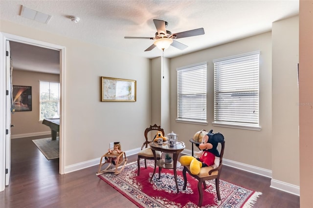 13525 Gorgona Isle Dr, Windermere, FL 34786 - sitting room with dark wood-type flooring, a ceiling fan, and baseboards