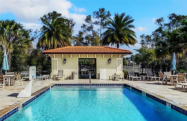 13525 Gorgona Isle Dr, Windermere, FL 34786 - community pool featuring a patio and fence