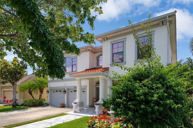 15630 N Himes Ave, Tampa, FL 33618 - italianate house with an attached garage, driveway, and stucco siding