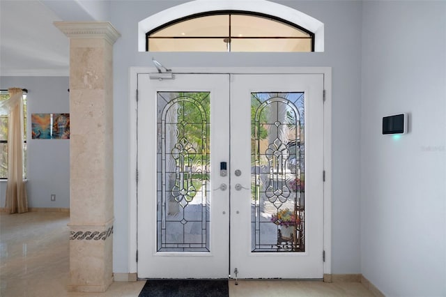 15630 N Himes Ave, Tampa, FL 33618 - foyer entrance featuring french doors, baseboards, and ornate columns