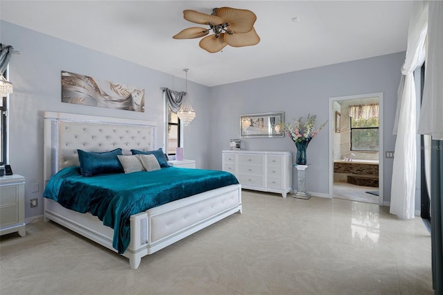15630 N Himes Ave, Tampa, FL 33618 - bedroom featuring baseboards, connected bathroom, and ceiling fan