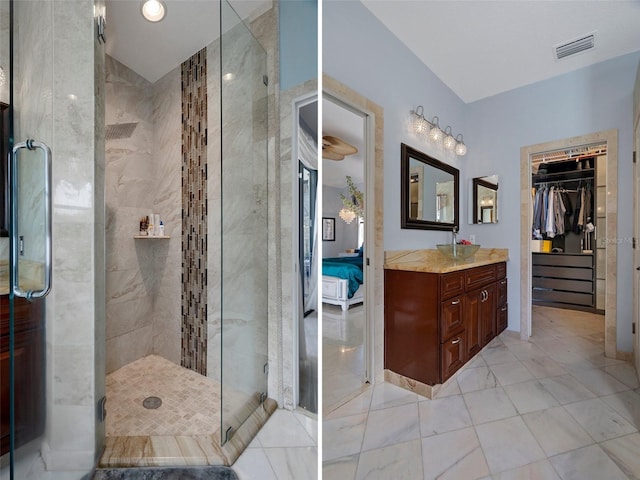 15630 N Himes Ave, Tampa, FL 33618 - ensuite bathroom with visible vents, marble finish floor, a stall shower, and vanity