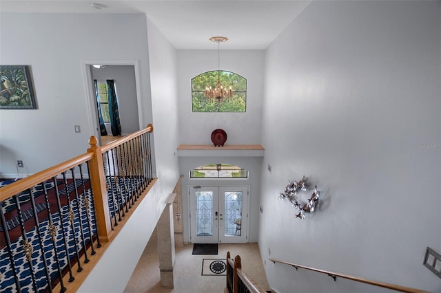 15630 N Himes Ave, Tampa, FL 33618 - entryway featuring french doors, a towering ceiling, and a chandelier