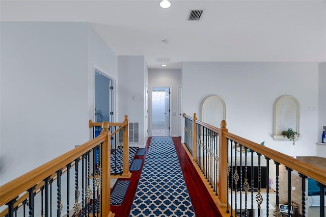 15630 N Himes Ave, Tampa, FL 33618 - hall with wood finished floors, an upstairs landing, visible vents, and recessed lighting