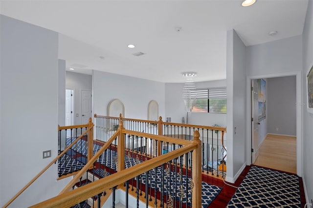 15630 N Himes Ave, Tampa, FL 33618 - hallway featuring baseboards, wood finished floors, an upstairs landing, and recessed lighting