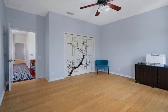 15630 N Himes Ave, Tampa, FL 33618 - living area featuring ceiling fan, baseboards, visible vents, and light wood-type flooring
