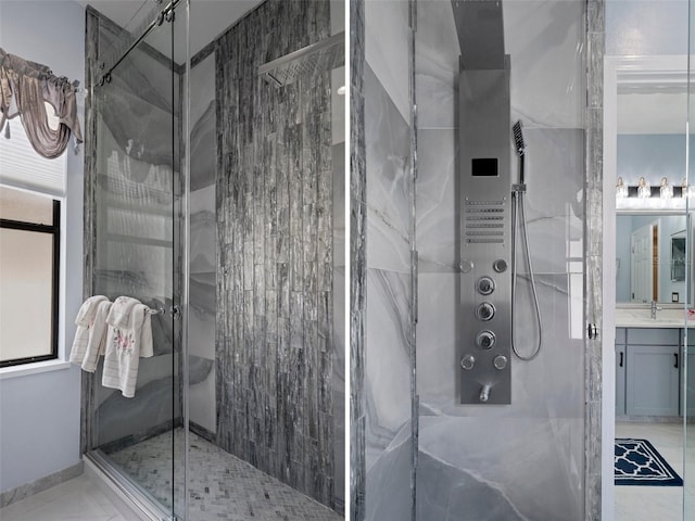 15630 N Himes Ave, Tampa, FL 33618 - bathroom featuring marble finish floor, vanity, and a marble finish shower
