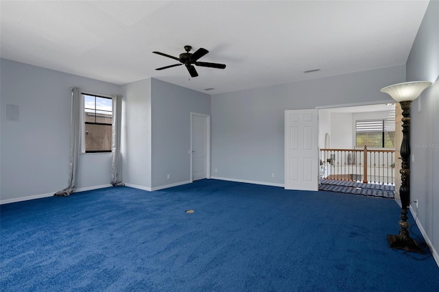 15630 N Himes Ave, Tampa, FL 33618 - spare room with a ceiling fan, baseboards, and dark carpet