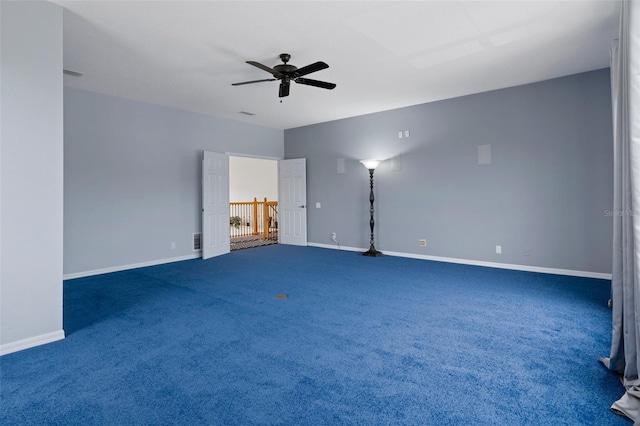 15630 N Himes Ave, Tampa, FL 33618 - empty room featuring carpet flooring, a ceiling fan, and baseboards