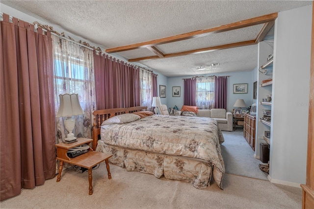 bedroom with light carpet and a textured ceiling