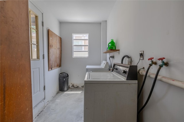 laundry area with separate washer and dryer and laundry area