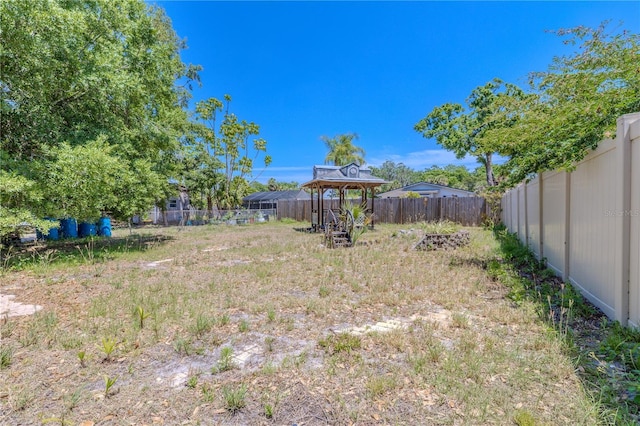 view of yard with a fenced backyard