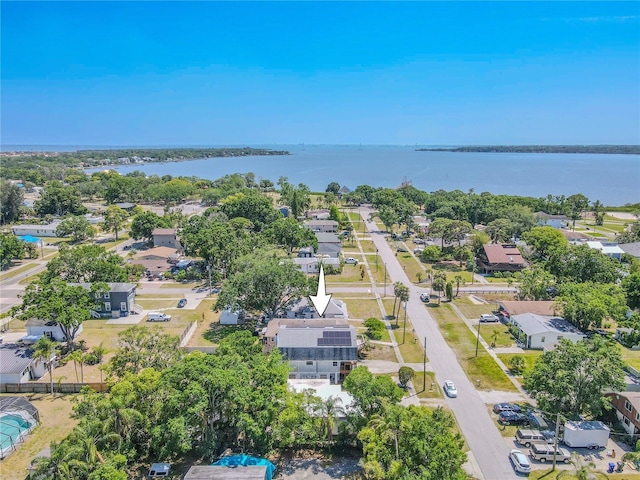 drone / aerial view with a residential view and a water view