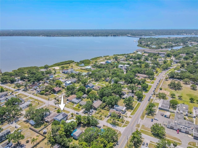 birds eye view of property with a water view and a residential view