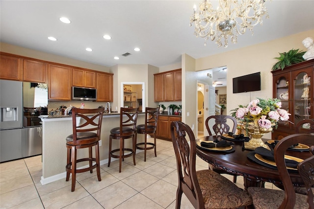 dining space with recessed lighting, a chandelier, visible vents, and light tile patterned floors