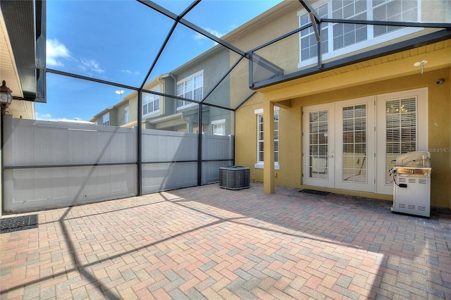 unfurnished sunroom with french doors