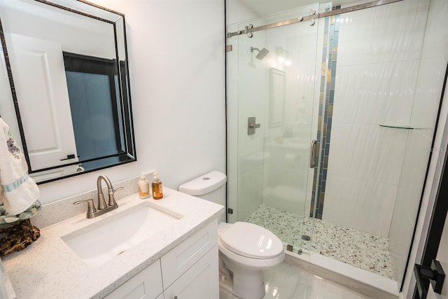 full bathroom with a shower stall, toilet, vanity, and marble finish floors