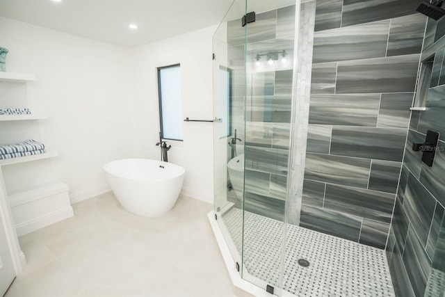 bathroom with a stall shower, a soaking tub, recessed lighting, and baseboards