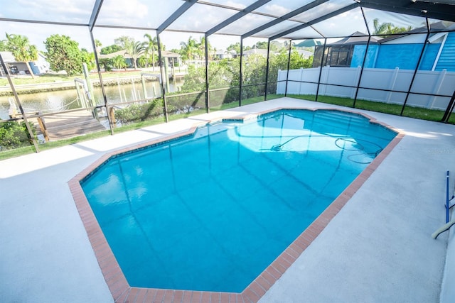 outdoor pool with a water view, a lanai, and a patio