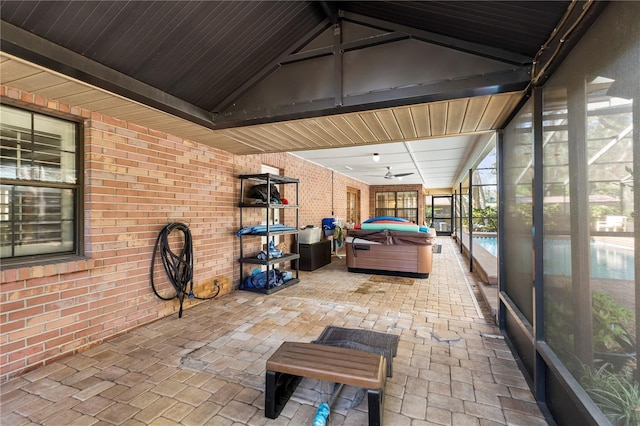 view of patio featuring a hot tub and a ceiling fan