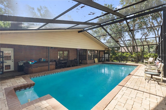 pool with a lanai and a patio