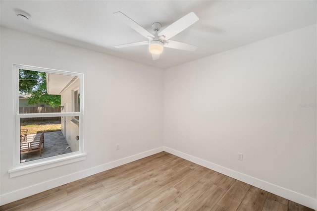 1401 49th St N, Saint Petersburg, FL 33710 - empty room with baseboards, wood finished floors, ceiling fan, and a smoke detector