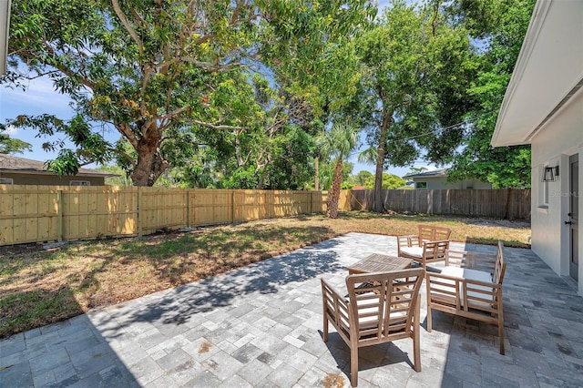 1401 49th St N, Saint Petersburg, FL 33710 - view of patio / terrace with a fenced backyard